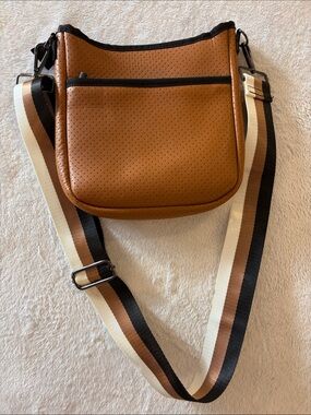Haute Shore Women's Crossbody Bag in Brown with Striped Adjustable Strap